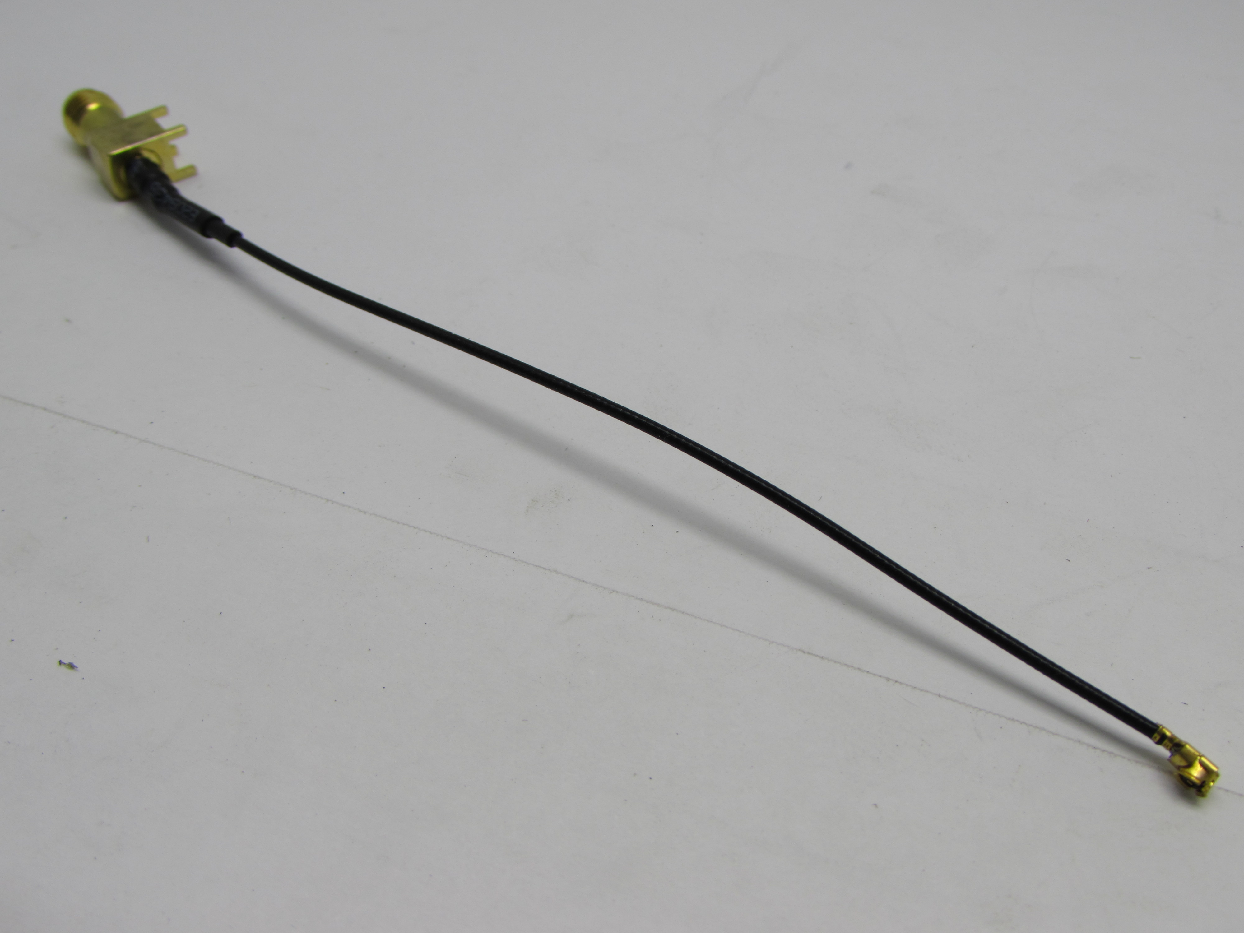 ANTENNA LINE CONNECTING CABLE 
SMA FEMALE RIGHT ANGLE PCB MOUNT TO IPX FEMALE CABLE (10CM)(IPX/SMAK)